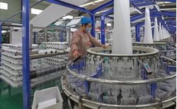 Chinese Textile Machinery Maker Unveils Latest Technologies